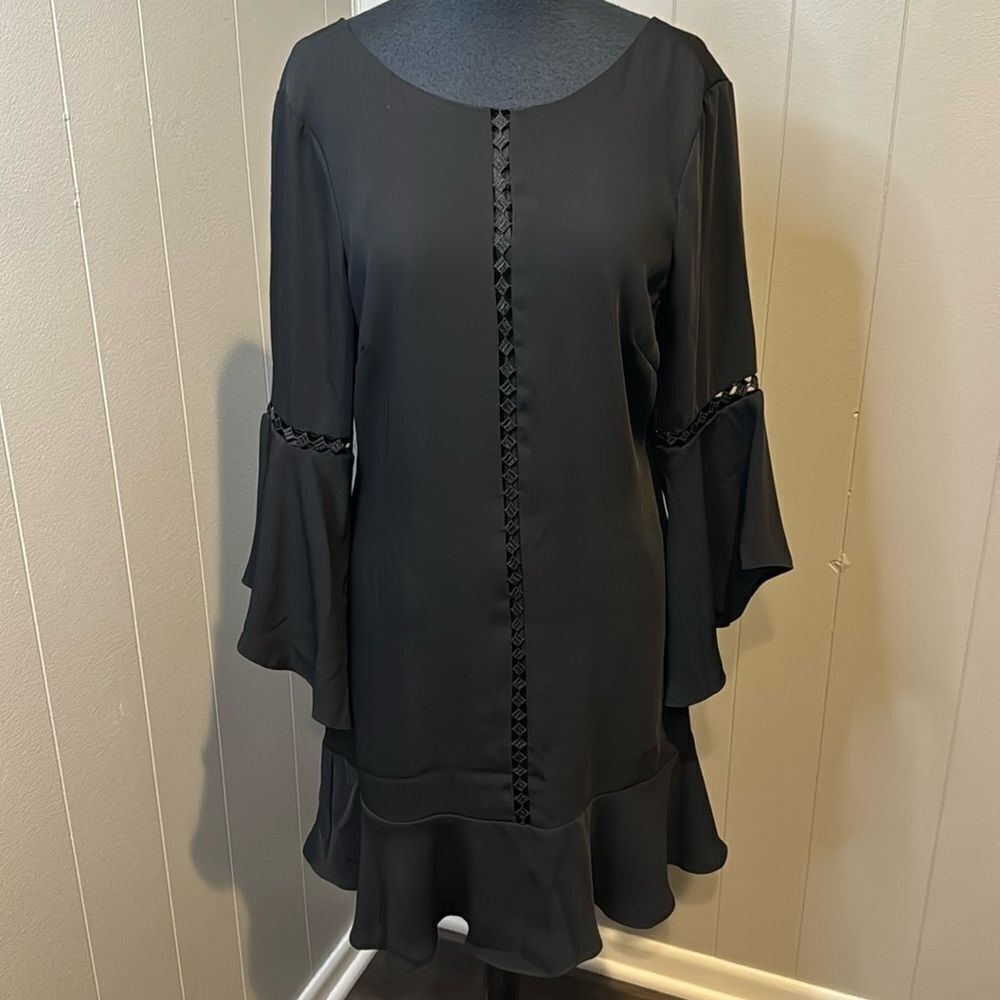 White House Black Market black drama sleeve lined shift. Wise ruffle hem. Size 6